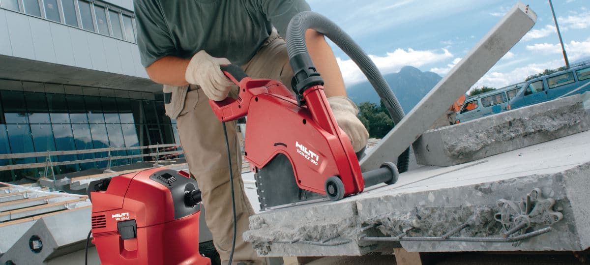 Worker using Hilti saw to cut concrete slab — slab cutting Palakkad